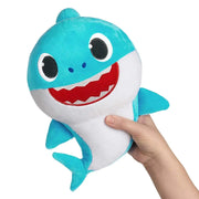 Close-up of Baby Sharks Singing Doll showing soft fabric and easy-to-use mechanism for little hands.