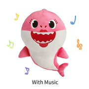 Happy child playing with Baby Sharks Singing Doll, encouraging early musical engagement and sensory development.